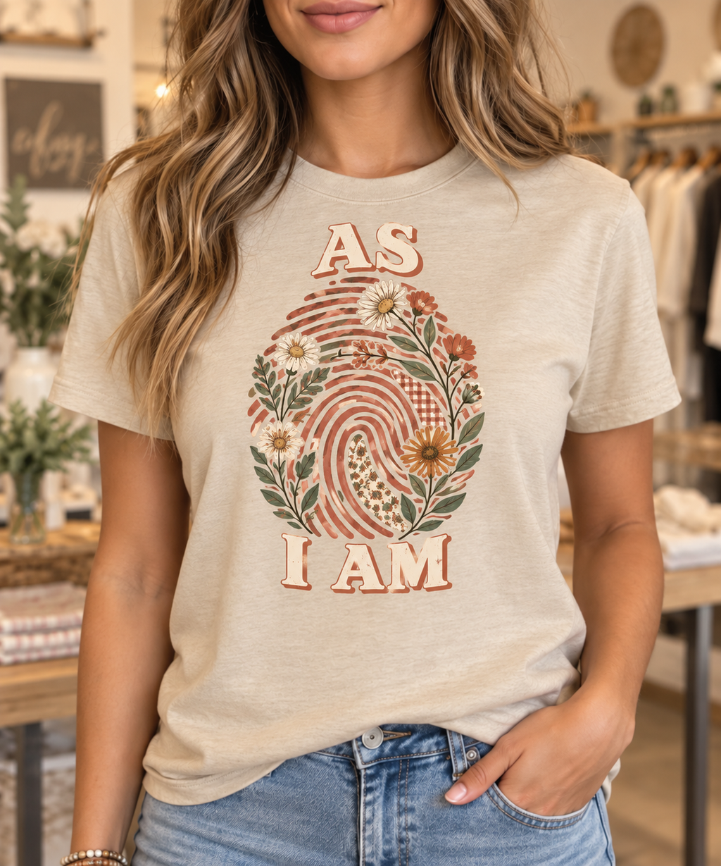 As I Am botanical fingerprint warm sand boutique tee modeled by a woman