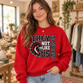 Boutique model in Hawks They Not Like Us red crewneck