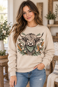 Woman wearing sand Highland cow botanical crewneck sweatshirt