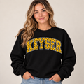 Woman wearing black Keyser polka dot crewneck
