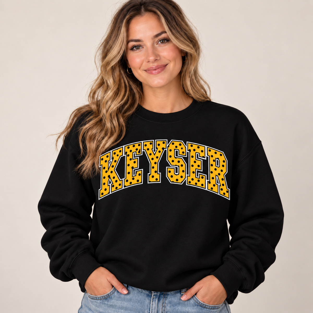 Woman wearing black Keyser polka dot crewneck