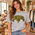 Model wearing heather gray Keyser Tornado bow T shirt