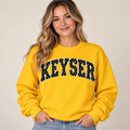 Woman wearing gold Keyser polka dot crewneck