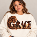GRACE lion design with embedded cross on cream crewneck
