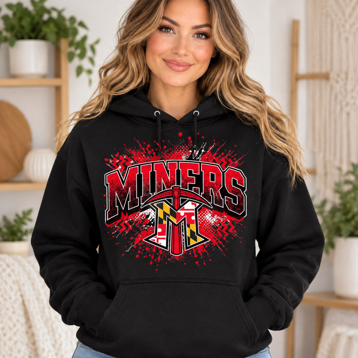 Woman modeling black Miners Maryland splatter hoodie