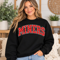 Woman modeling black MINERS crewneck with red and white polka dot lettering