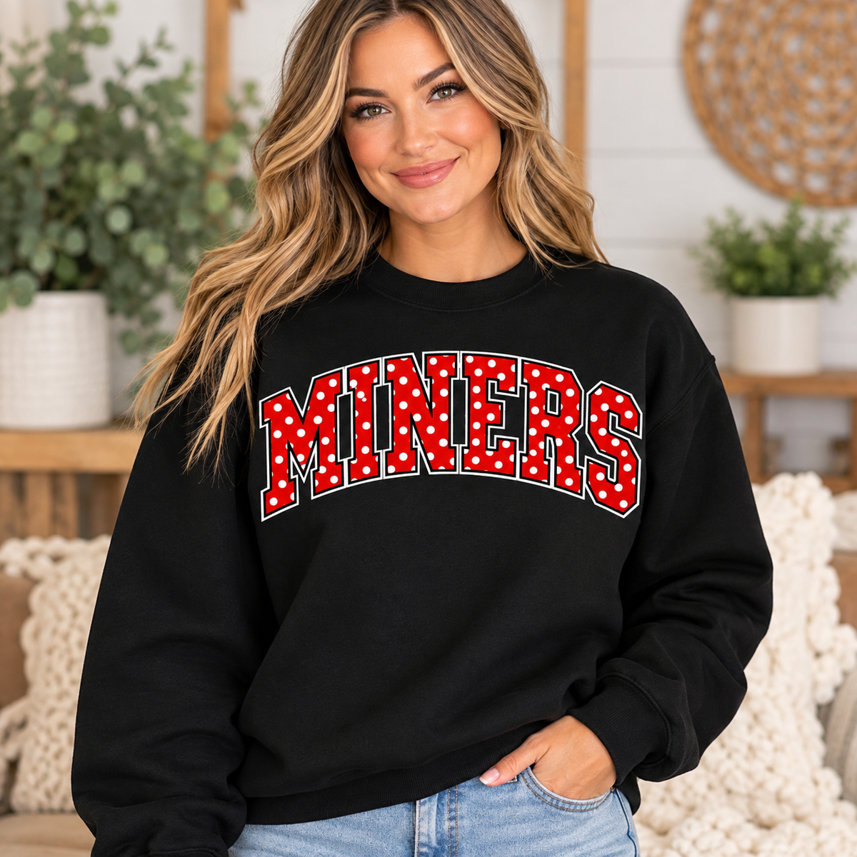 Woman modeling black MINERS crewneck with red and white polka dot lettering