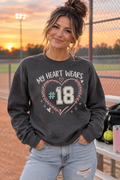 Woman wearing charcoal My Heart Wears personalized player number crewneck