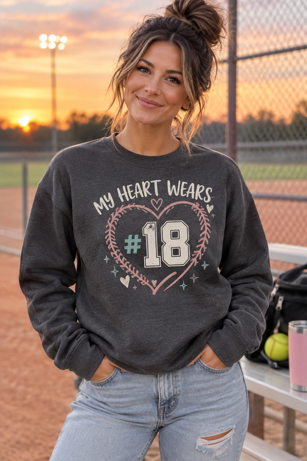 Woman wearing charcoal My Heart Wears personalized player number crewneck