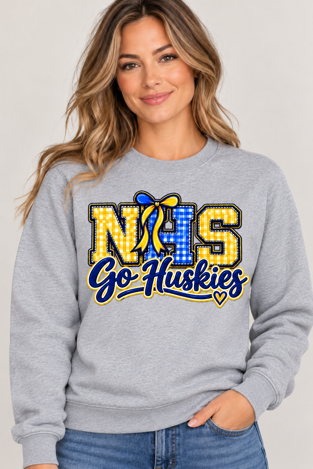 Woman wearing Heather Gray Northern NHS Go Huskies crewneck