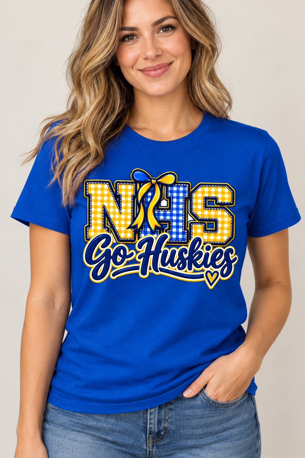 Woman wearing Royal Blue Northern NHS Go Huskies T shirt