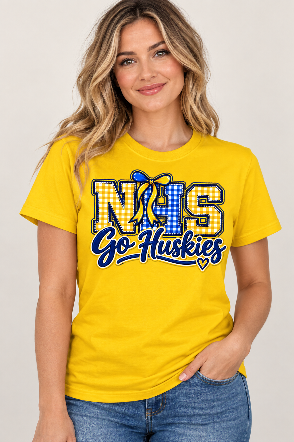 Woman wearing Yellow Northern NHS Go Huskies T shirt