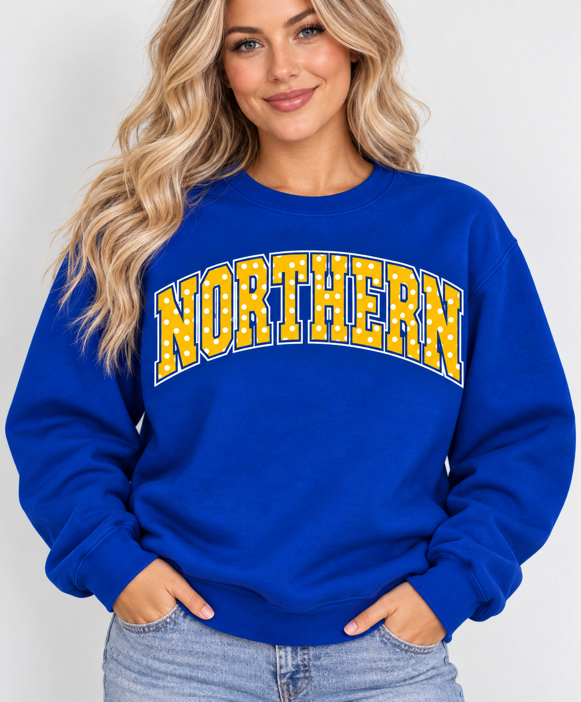 Model wearing royal blue NORTHERN polka dot crewneck