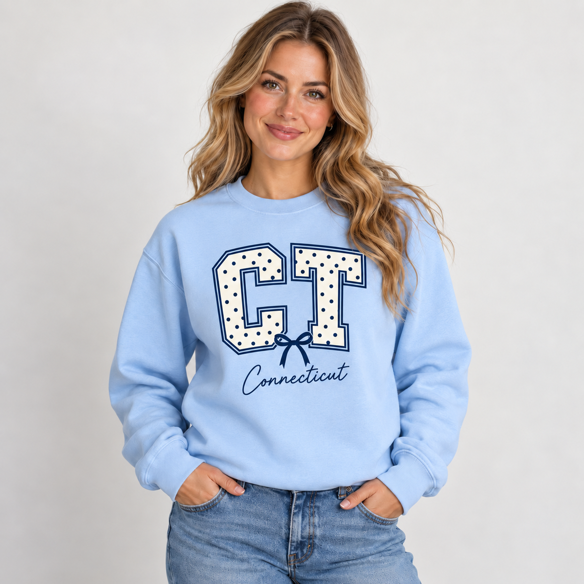 Connecticut polka dot varsity design on a light blue crewneck
