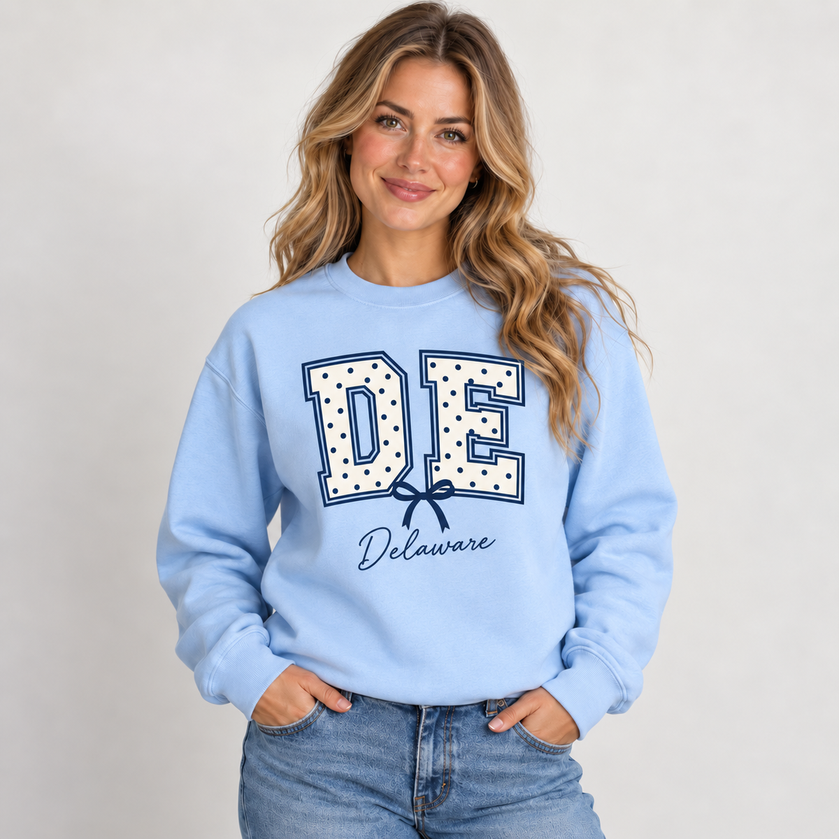Delaware polka dot varsity design on a light blue crewneck
