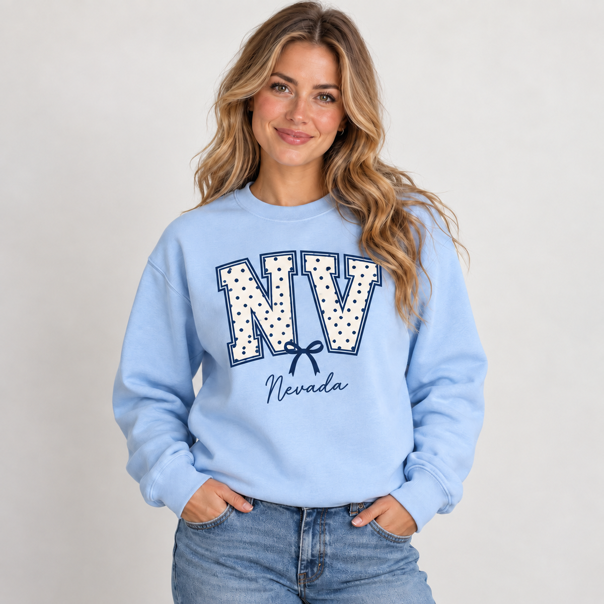 Nevada polka dot varsity design on a light blue crewneck