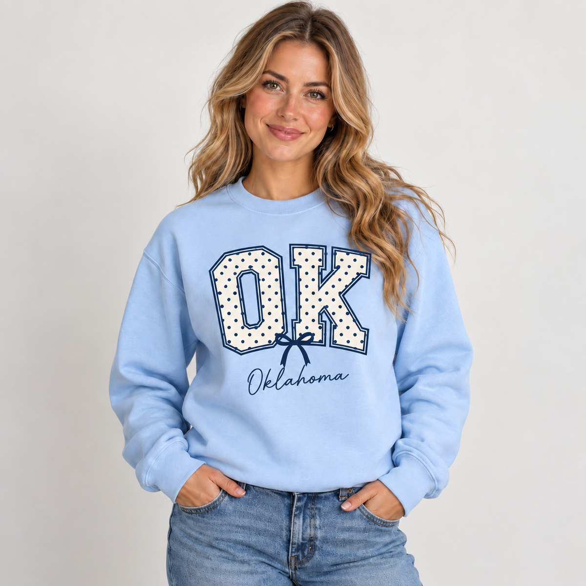 Oklahoma polka dot varsity design on a light blue crewneck