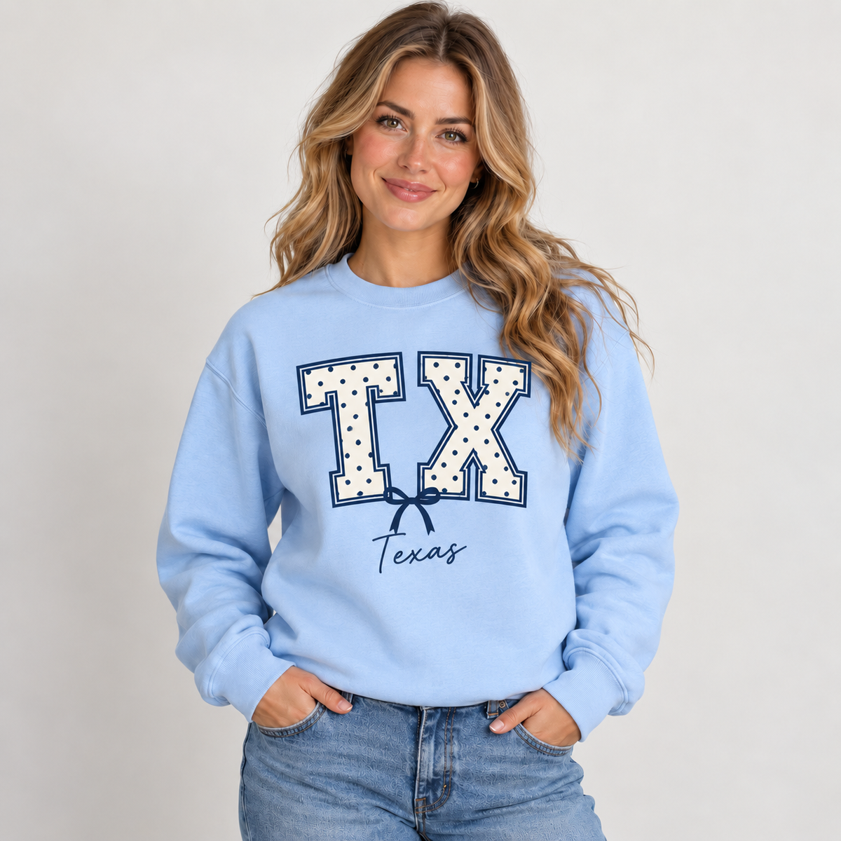 Texas polka dot varsity design on a light blue crewneck
