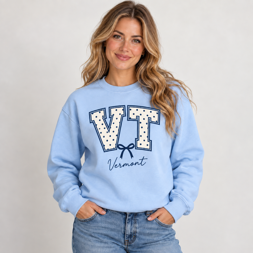 Vermont polka dot varsity design on a light blue crewneck