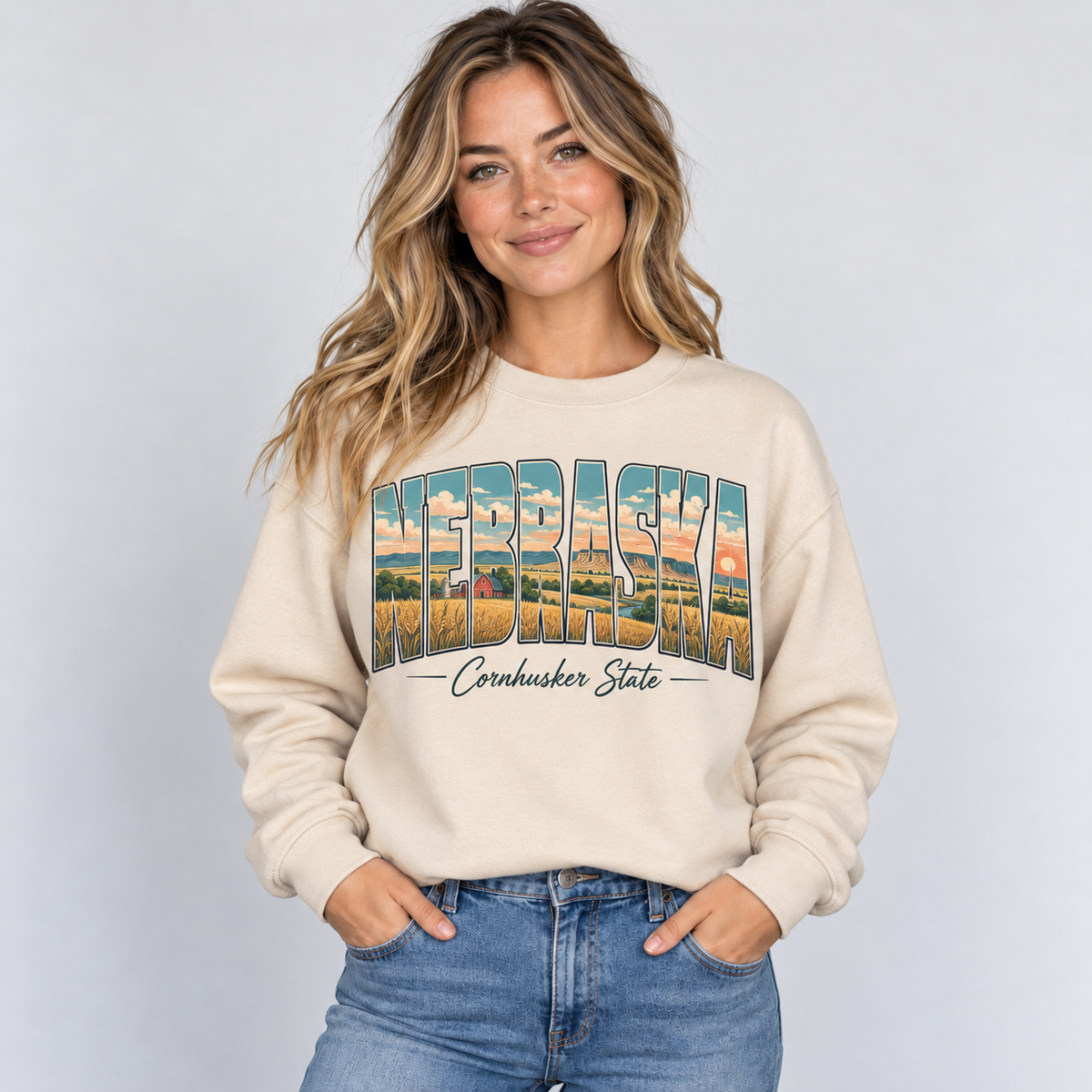 Nebraska vintage postcard design on a sand crewneck
