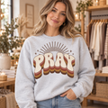 Woman wearing Retro PRAY Ash crewneck sweatshirt