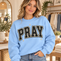 Woman wearing Varsity PRAY Light Blue crewneck sweatshirt