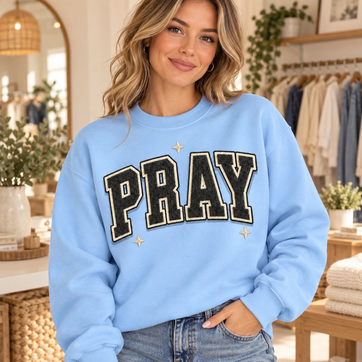 Woman wearing Varsity PRAY Light Blue crewneck sweatshirt